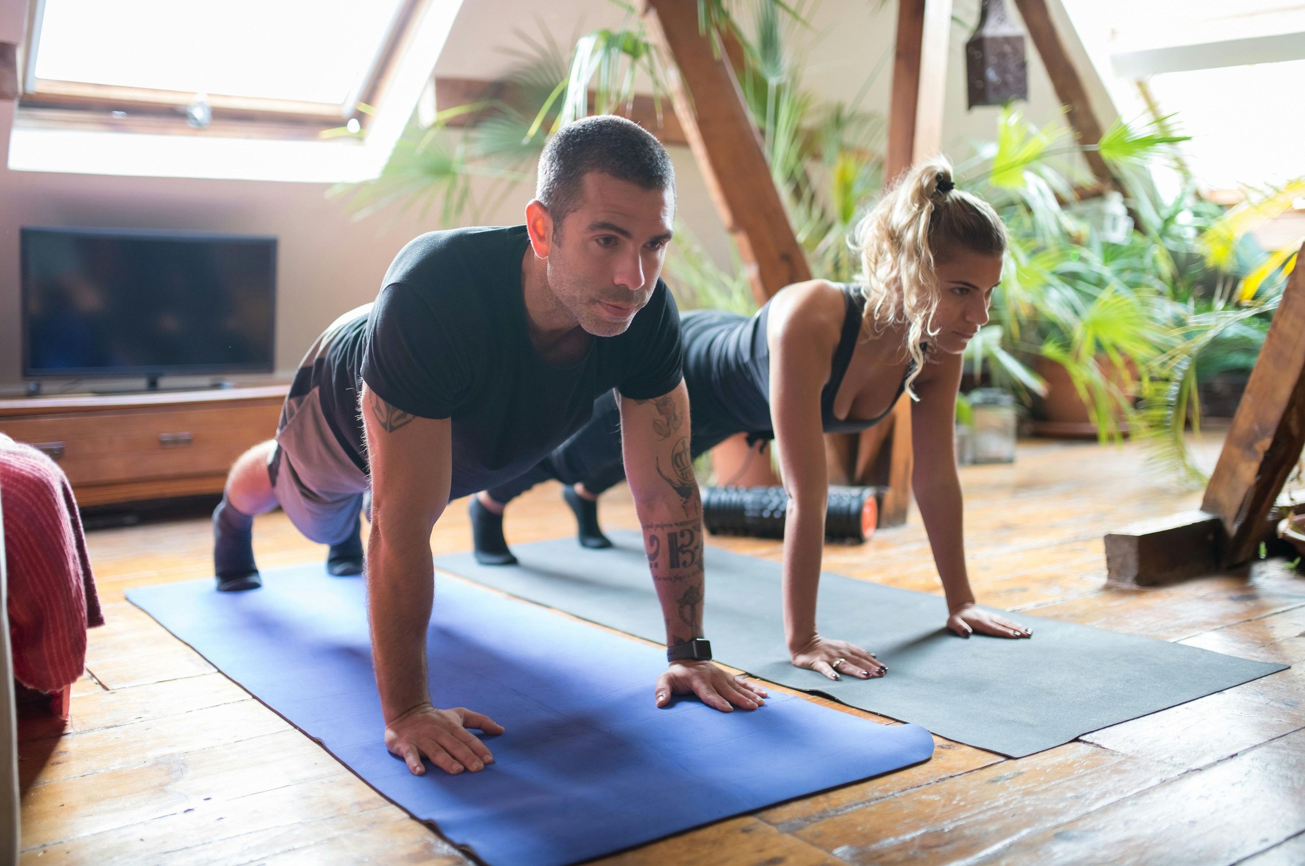 Woman doing plank exercise at home for belly fat loss and core strength